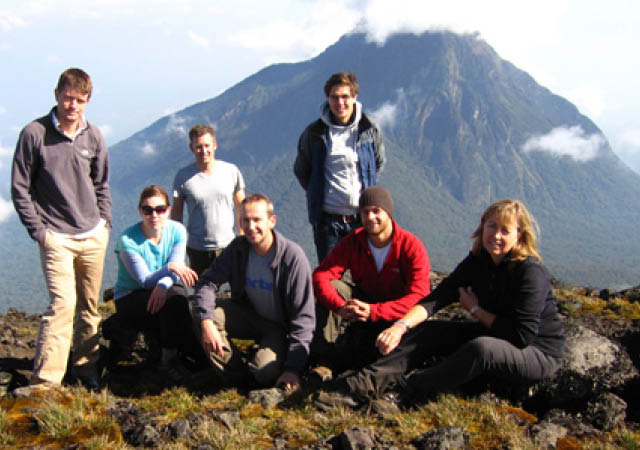Guests enjoying a volcano hiking safari in Rwanda organised by a Uganda Safari Company specialising in tailor-made East African safari experiences.