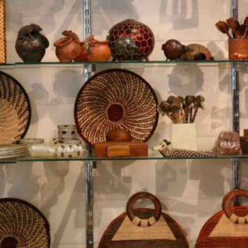 Traditional handmade baskets, pottery, wood carvings and artisan crafts displayed during a craft workshop in Uganda