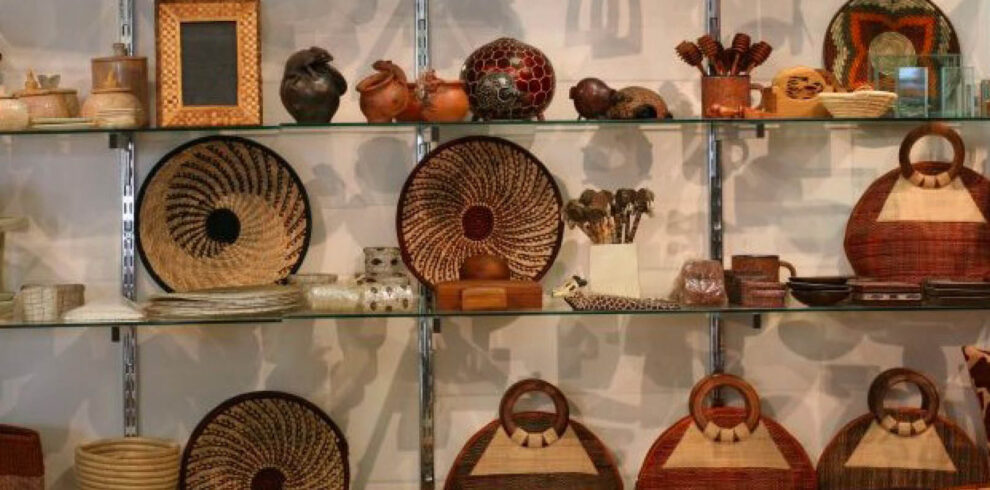 Traditional handmade baskets, pottery, wood carvings and artisan crafts displayed during a craft workshop in Uganda