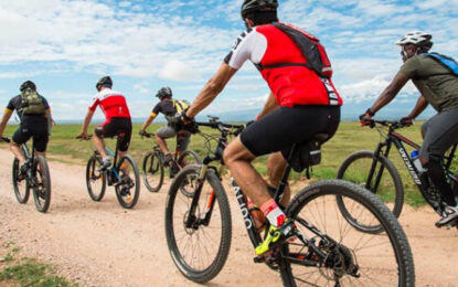 Travellers enjoying a guided cycling safari through Uganda’s scenic countryside