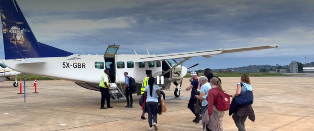 Travellers boarding a light aircraft for a Fly-in Safaris in Uganda before departing to a national park