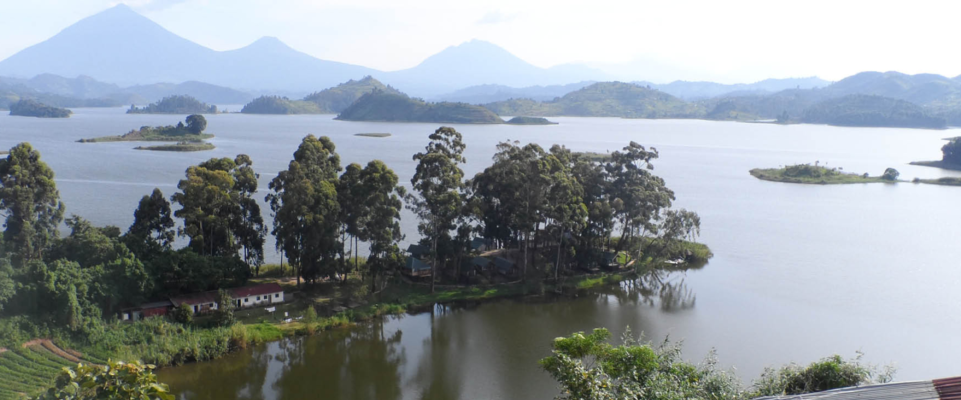Panoramic view of Lake Mutanda with scenic islands and the Virunga Mountains in southwestern Uganda.
