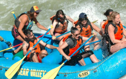 Travellers navigating exciting white water rapids during a rafting adventure on the River Nile in Jinja, Uganda