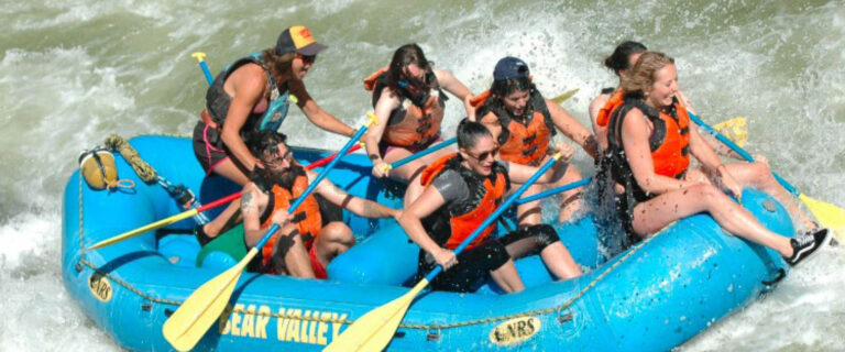 Travellers navigating exciting white water rapids during a rafting adventure on the River Nile in Jinja, Uganda