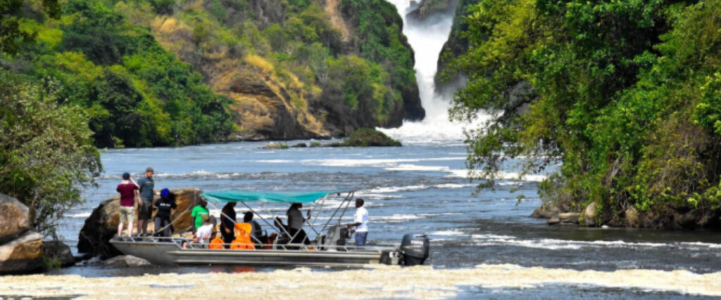 5 Days Uganda Safari with travellers viewing wildlife on a boat safari in Uganda
