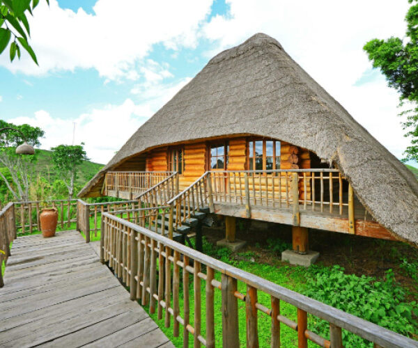 Cultural Safari accommodation in Uganda with traditional African-inspired lodge cottages