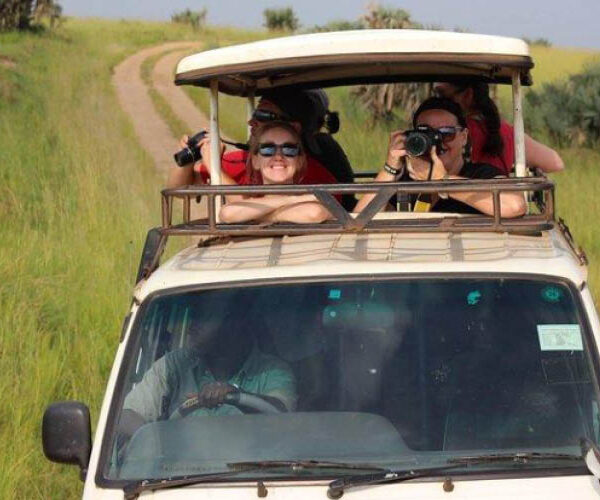 Guests enjoying a private 4×4 safari game drive in Uganda's savannah