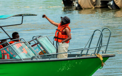 Travellers enjoying a boat safari on the Kazinga Channel in Uganda