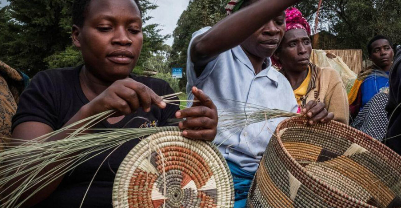 Community artisans weaving traditional baskets during a cultural experience