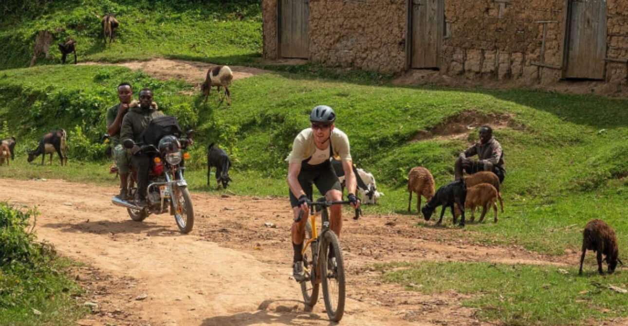 Cycling in Uganda and Rwanda along a rural village road