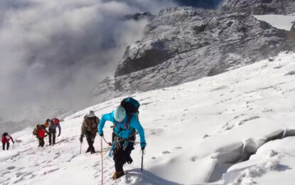 Mountaineers climbing toward Margherita Peak in the Rwenzori Mountains, Uganda