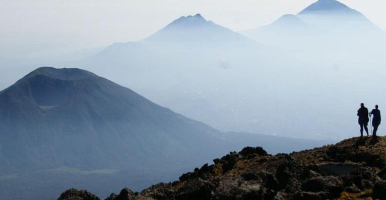 Hikers overlooking the Virunga Mountains in Rwanda