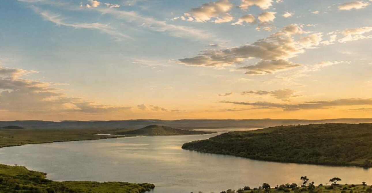 Scenic lake and savannah landscape in Akagera National Park, Rwanda.