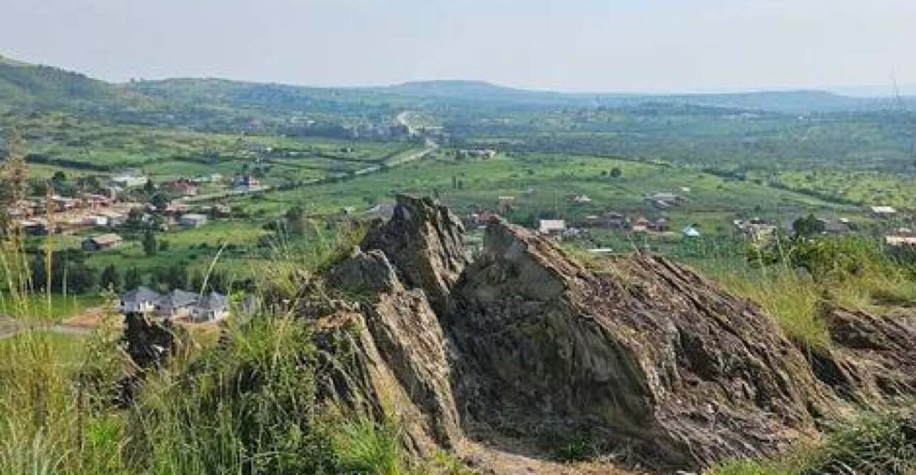Rolling hills and cloudy skies viewed from Biharwe Hill near Mbarara in Ankole Region, southwestern Uganda.