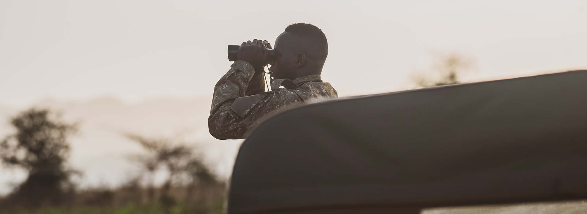 Bird watching in Uganda and Rwanda featuring a guide.