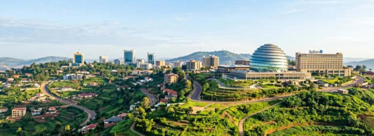 Panoramic view of Kigali Rwanda showing the city's buildings and surrounding green hills.