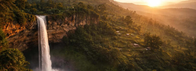 Scenic view of Sipi Falls cascading through lush green highlands in the Mount Elgon Region of eastern Uganda.