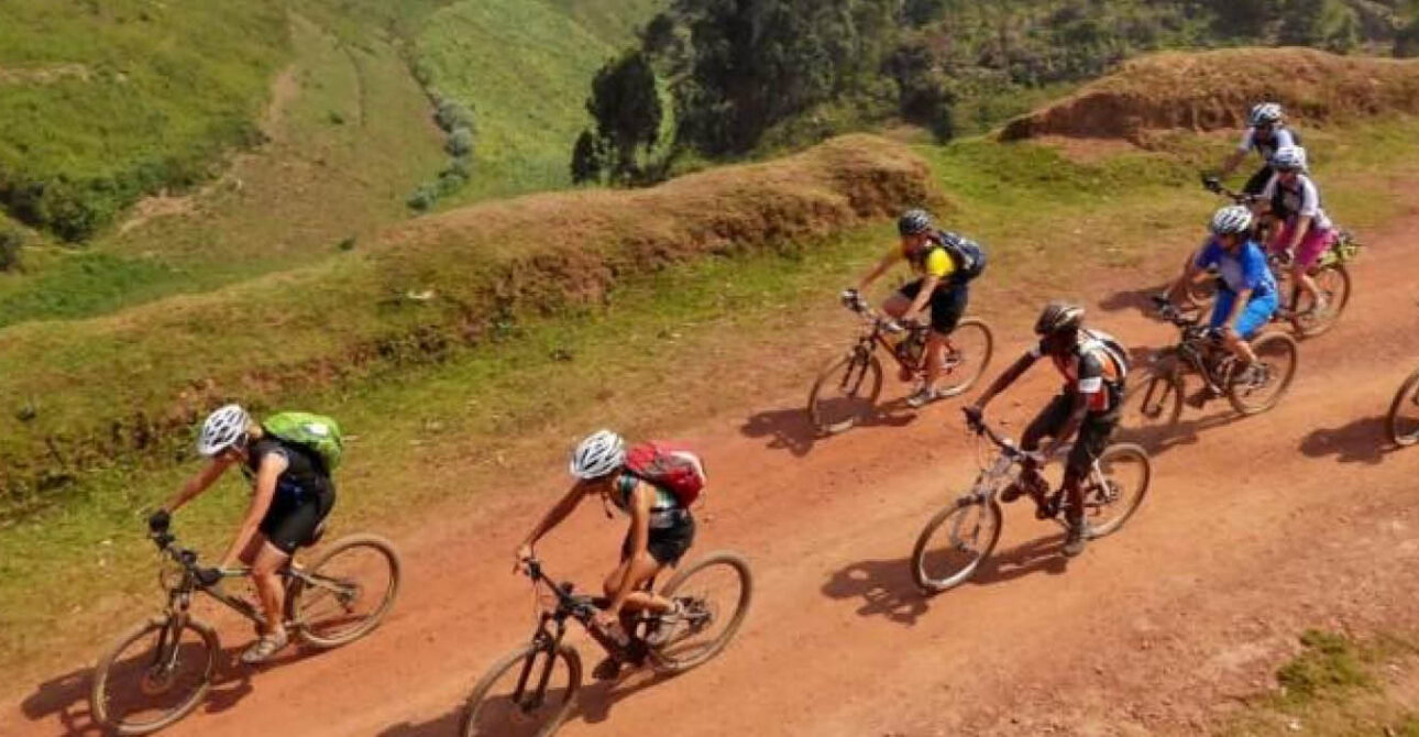 Cycling through Rwanda's scenic hills during an adventure safari.