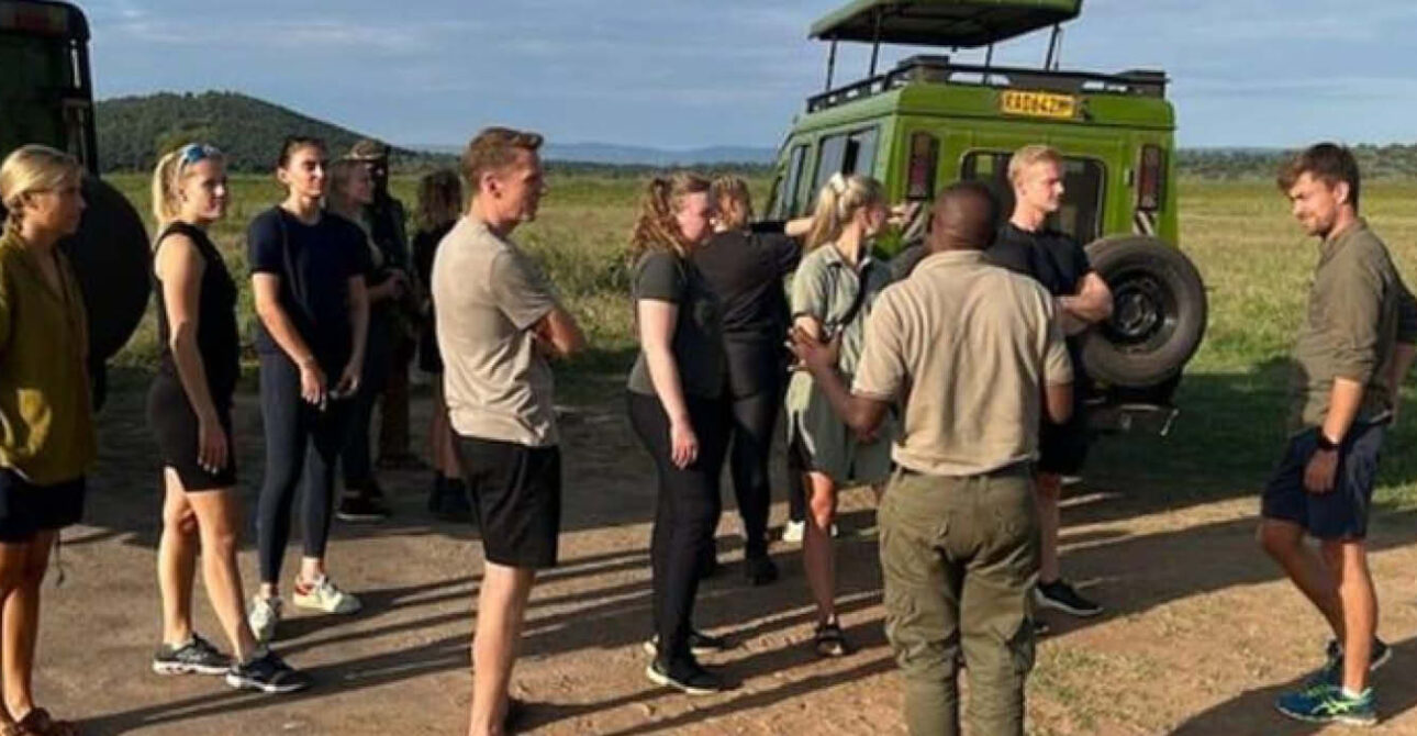 Travellers with safari guides during a Rwanda safari