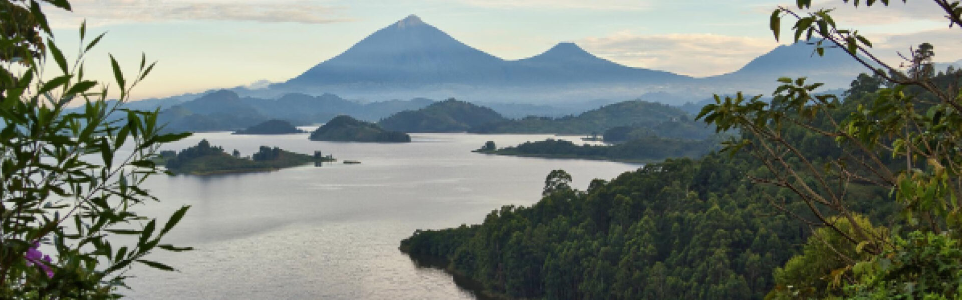Uganda safari destinations featuring scenic lakes, forested islands and distant volcanic mountains