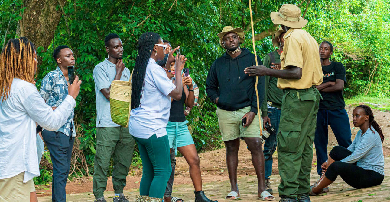 Travellers enjoying a guided Uganda safari experience in the forest
